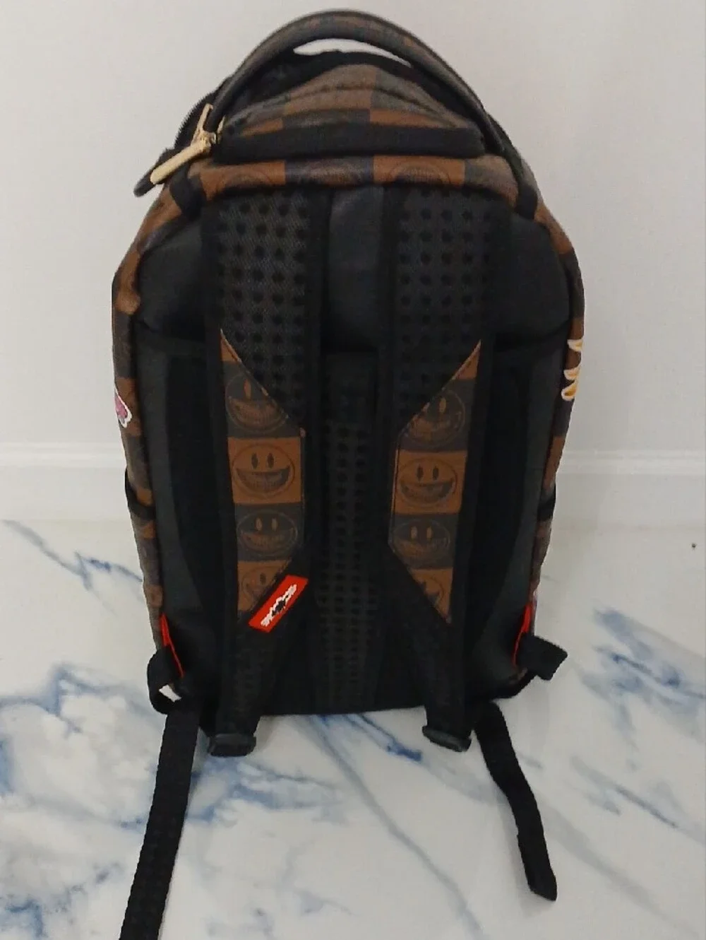 Sprayground Brown Checkerboard Backpack with Multicolor Sticker Graphics